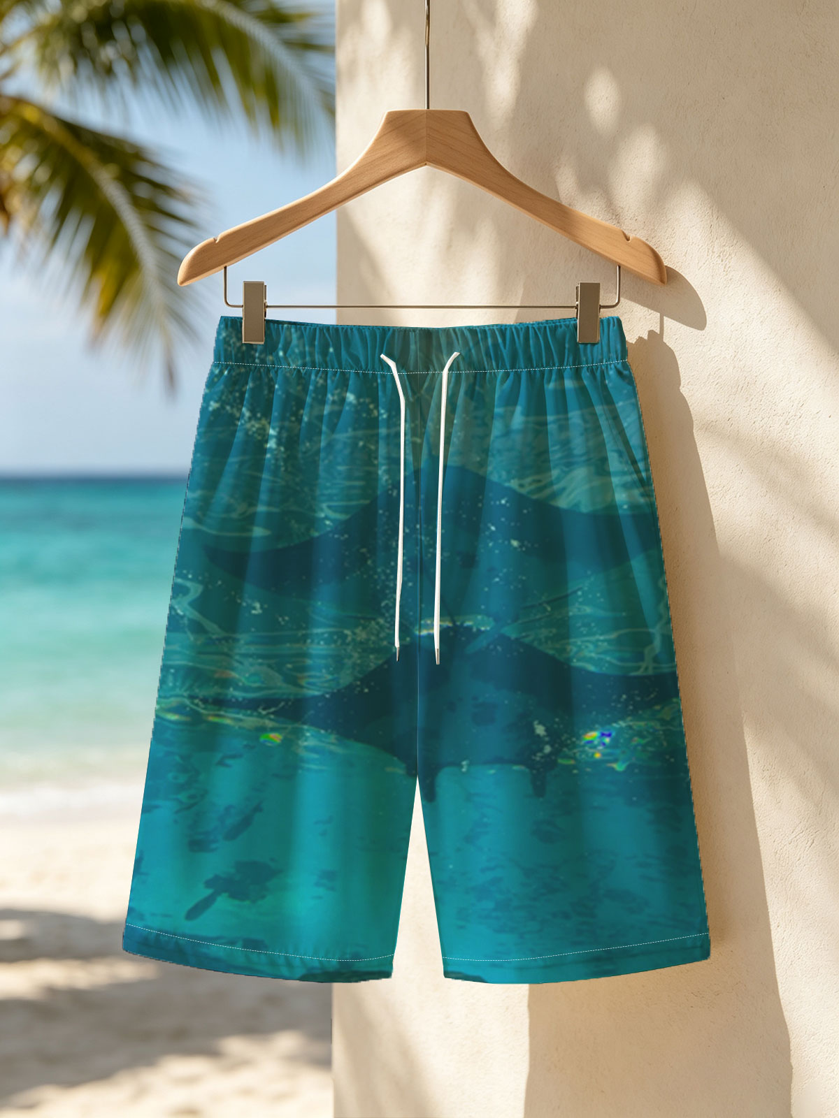 Graceful manta rays glide through clear blue waters, their silhouettes dancing beneath the surface. -  Beach shorts