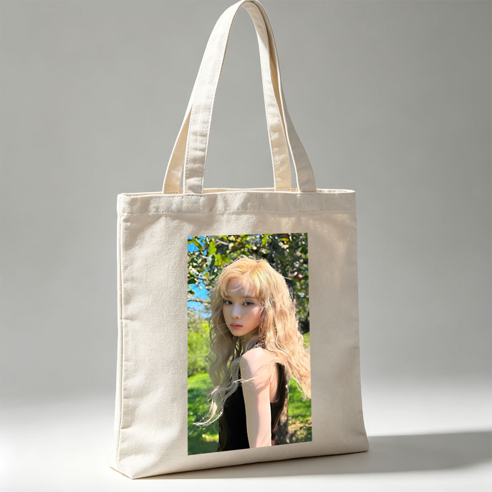 Kim Yoo Jung in a Sunlit Garden with Flowing Blonde Hair and Elegant Black Dress - Canvas tote bags
