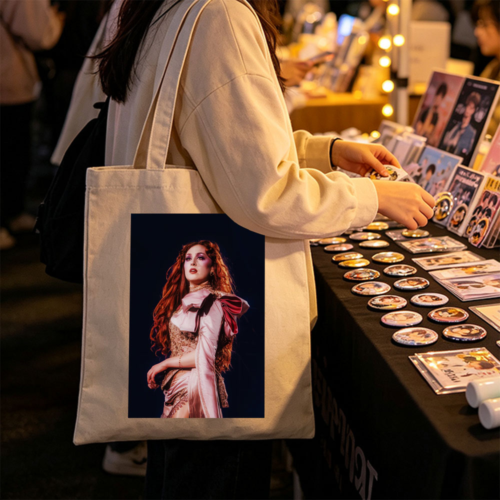 Katy Perry in a Dramatic Performance Scene Wearing a Pink Satin Outfit with Elegant Makeup and Long Red Hair - Canvas tote bags