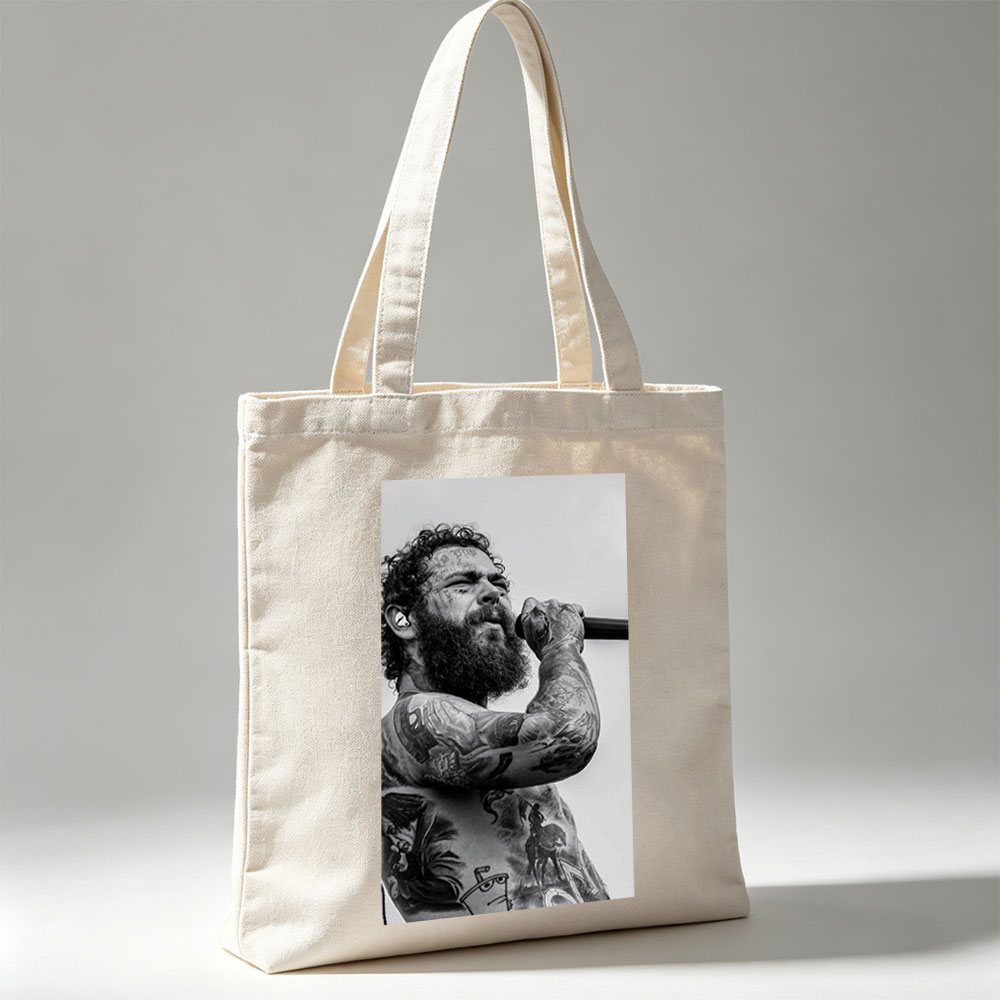 Post Malone Performing on Stage with Tattooed Arms and Beard in Black and White Photo - Canvas tote bags
