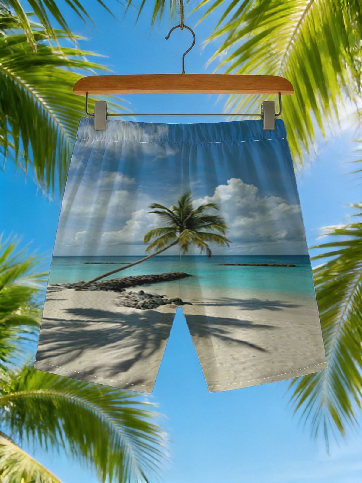 Tropical beach with palm tree leaning over turquoise water and white sand under blue sky. -  Beach shorts