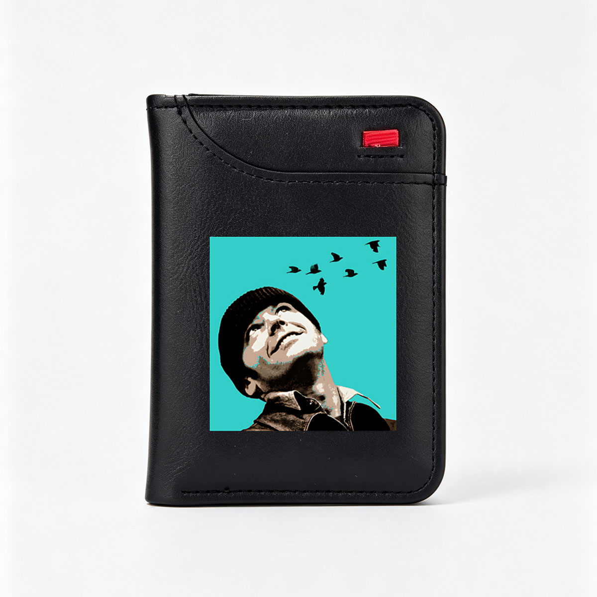 Man in Beanie Gazing at Flying Birds Against Teal Sky - Vertical Style Wallet