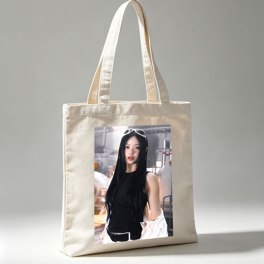 Hanni of NewJeans in a Futuristic Studio Setting Wearing a Black Top and White Ruffled Skirt with Sunglasses on Head - Canvas tote bags