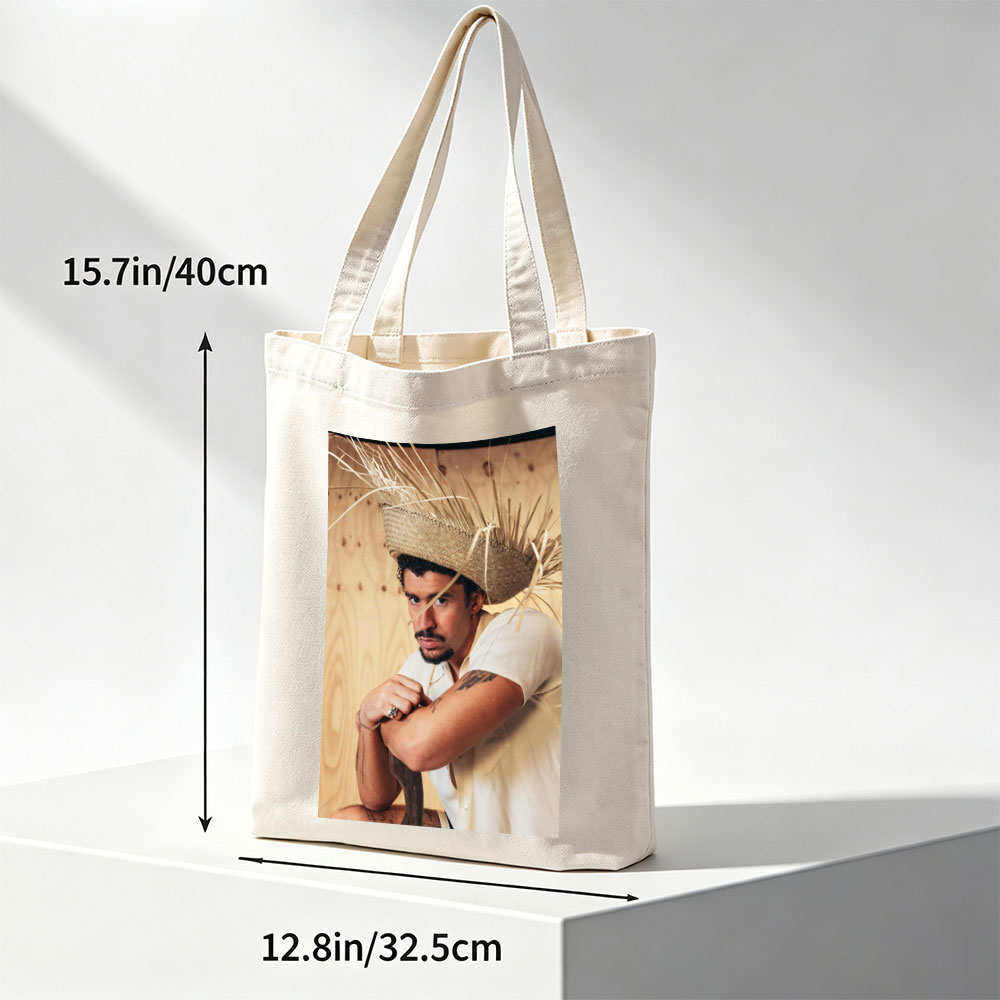 Bad Bunny Wearing a Straw Hat with Hay Sticks, Leaning Against a Wooden Wall in a Casual Pose - Canvas tote bags