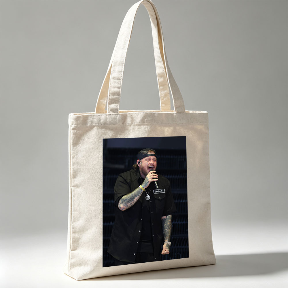 Cody Johnson Performing on Stage with Microphone and Tattooed Arms - Canvas tote bags