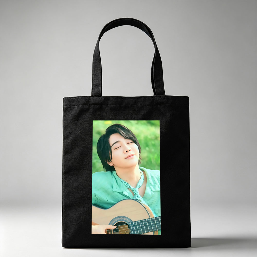 Yuki Kajiura in a Serene Outdoor Setting Playing Acoustic Guitar with Eyes Closed - Canvas tote bags