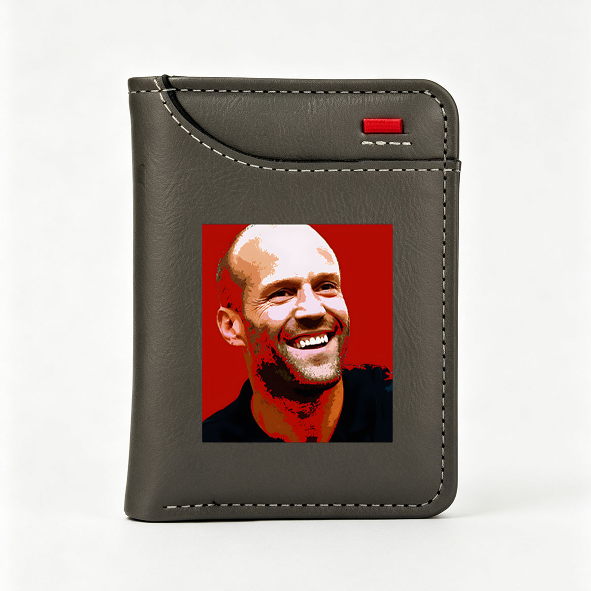Jesse Ventura, former Governor of Minnesota and professional wrestler, smiling against a red background. - Vertical Style Wallet