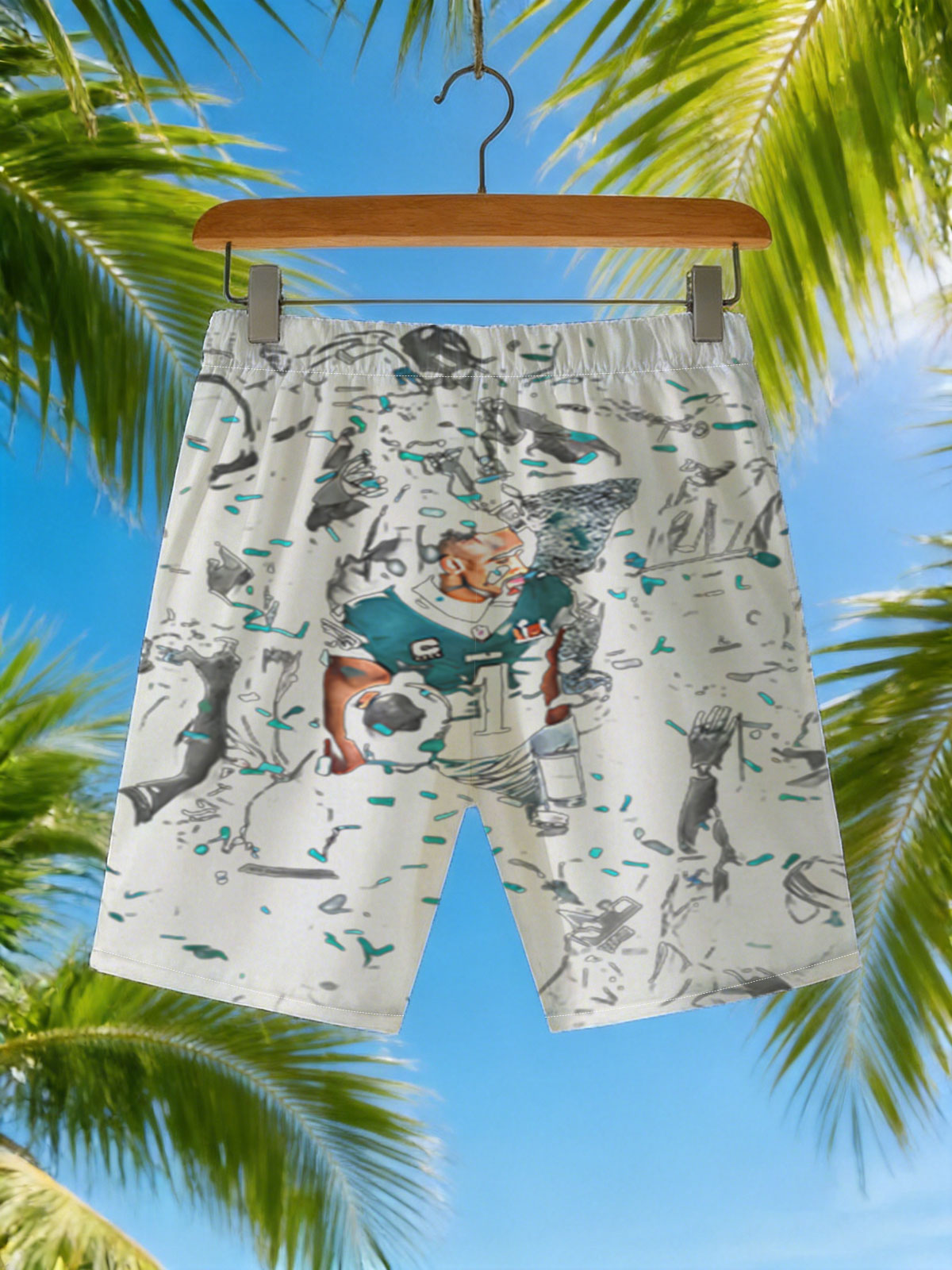 Tua Tagovailoa, Miami Dolphins QB, celebrates with teammates and confetti in a dynamic team moment. -  Beach shorts