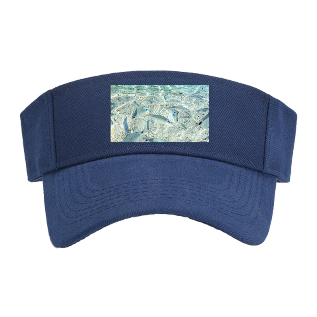 Clear waters reveal schools of fish swimming near a rocky shore with boats in the distance. -  Visor cap
