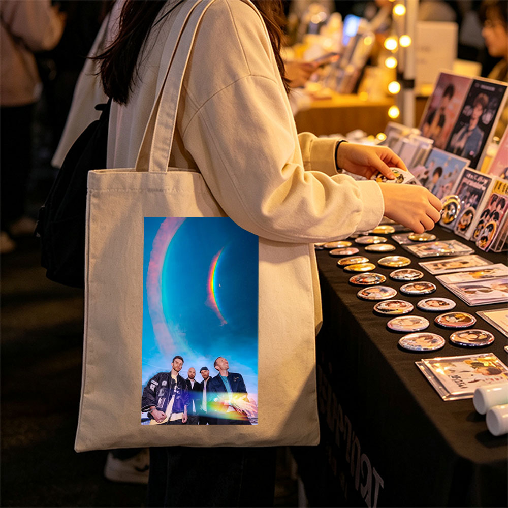Coldplay in a Cosmic Scene with Rainbow Halo and Starry Sky Background - Canvas tote bags