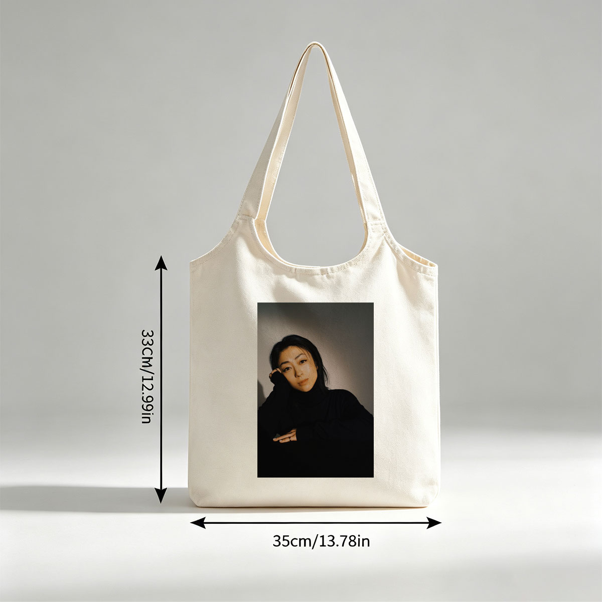 Yoko Kanno in a Moody Portrait Wearing Black Turtleneck with Dramatic Lighting - Canvas shoulder bags/