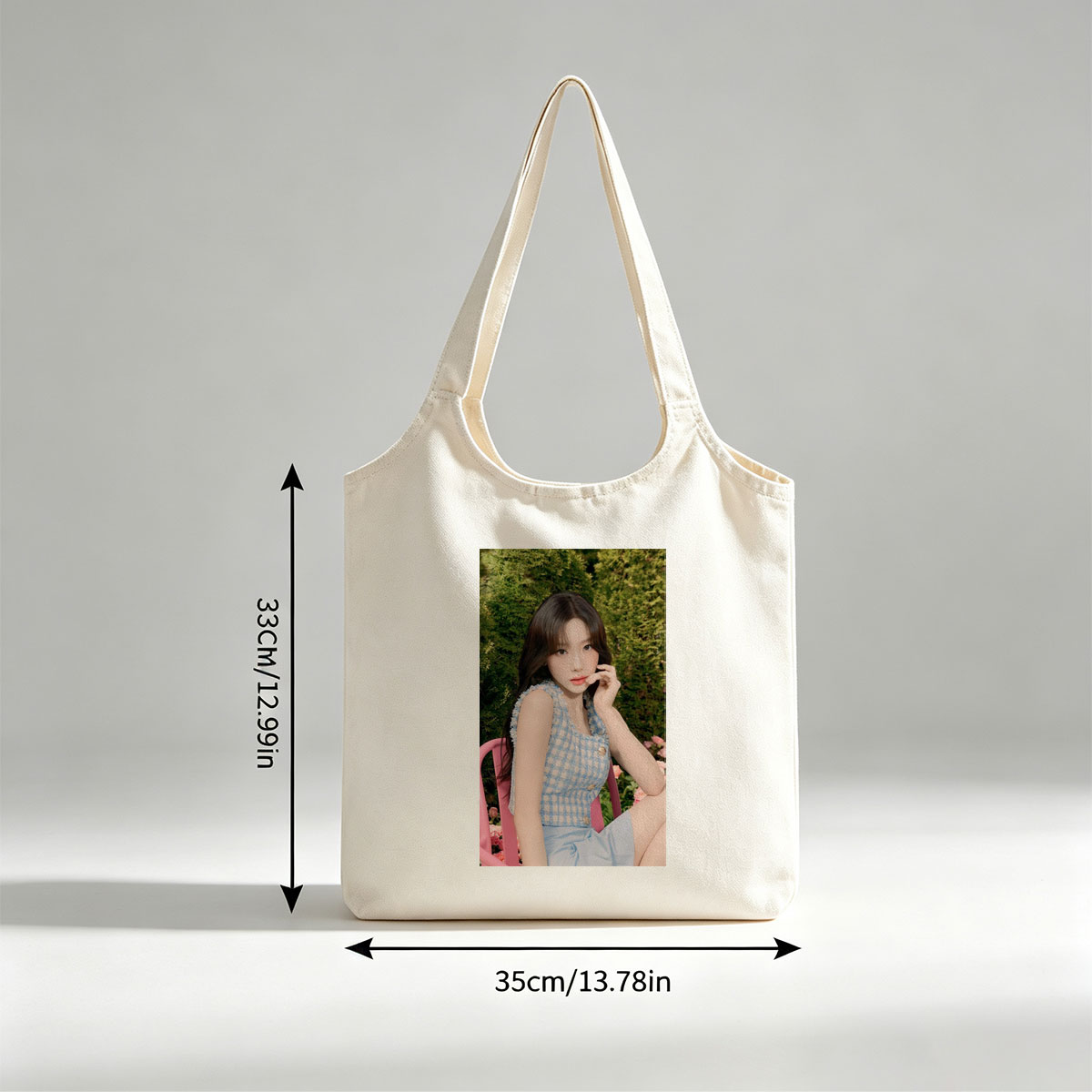 Tzuyu in a Garden Scene Wearing a Blue Checkered Top and Light Blue Skirt, Sitting on a Pink Chair Amidst Greenery and Flowers - Canvas shoulder bags/