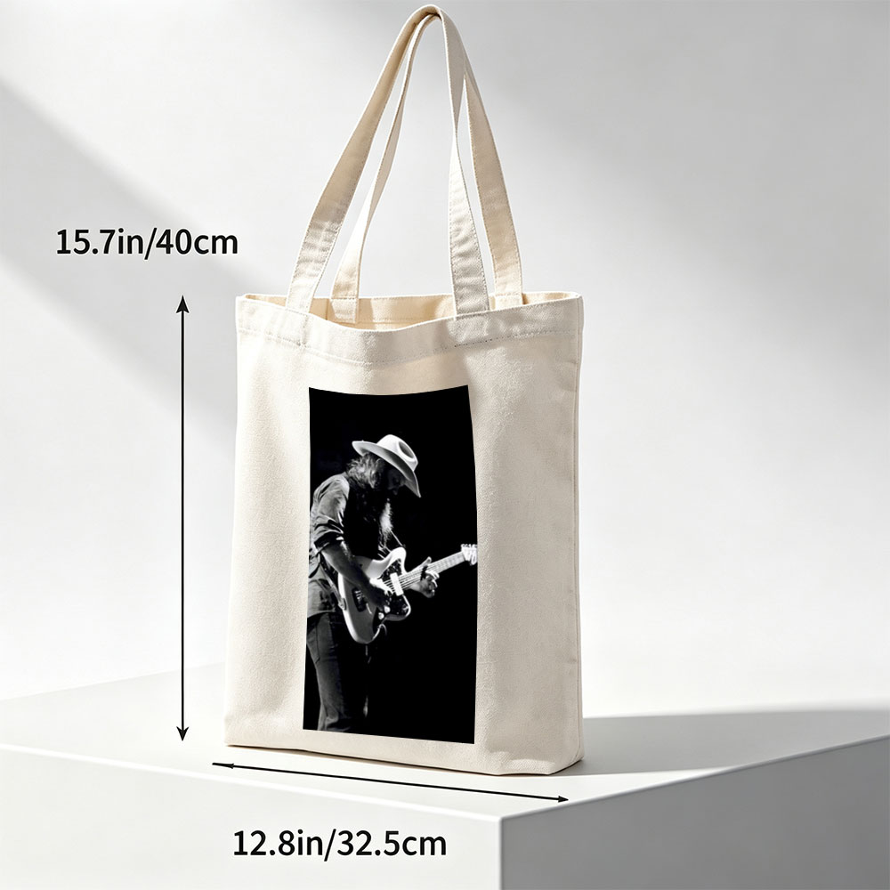 Stevie Ray Vaughan Playing Guitar on Stage in Black and White Photo - Canvas tote bags