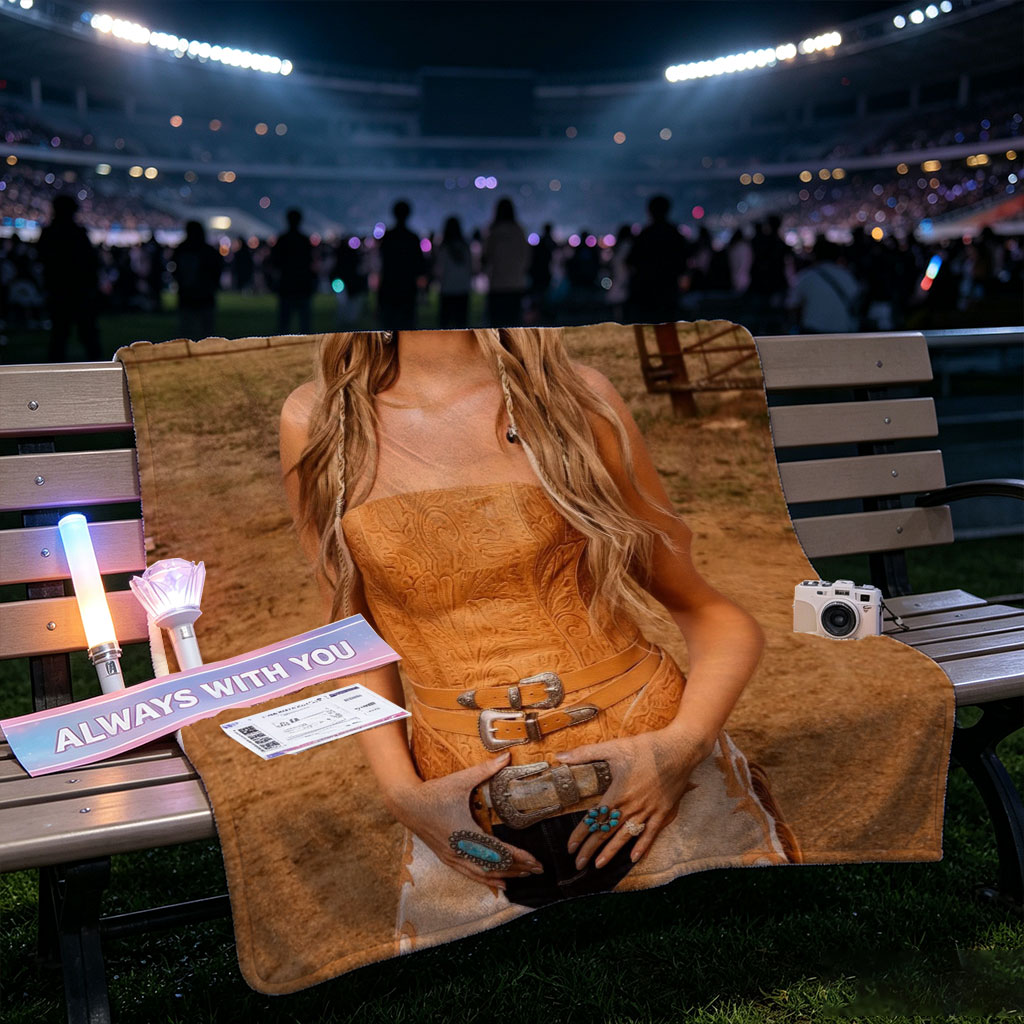 Paris Hilton in Cowboy Chic: Wearing a Tan Hat and Embroidered Corset Outfit on a Ranch - Blankets