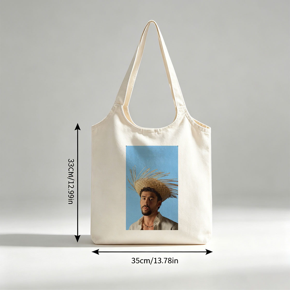Bad Bunny Wearing a Straw Hat with Spiky Design Against a Blue Background - Canvas shoulder bags/