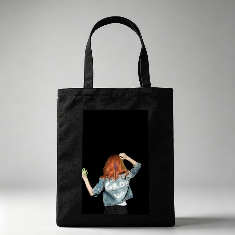 BTS Jungkook in a vibrant performance scene with colorful hair and denim jacket against a black background - Canvas tote bags
