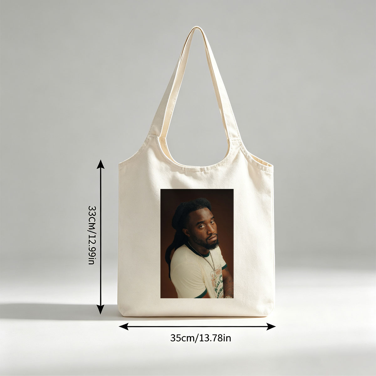 Burna Boy in a Stylish Portrait Wearing a White T-Shirt and Beaded Necklace - Canvas shoulder bags/