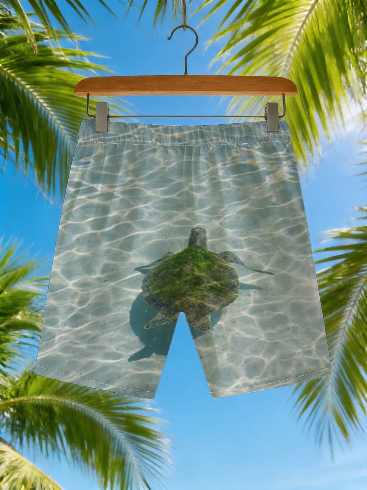 Sea turtle swimming in clear shallow water -  Beach shorts