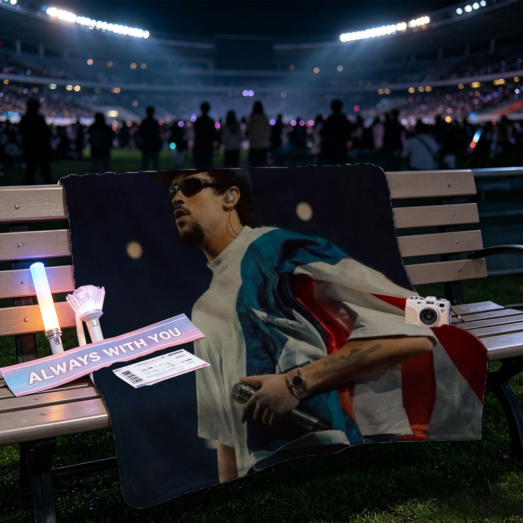 Bad Bunny Performing on Stage with Puerto Rican Flag Draped Over Shoulders - Blankets