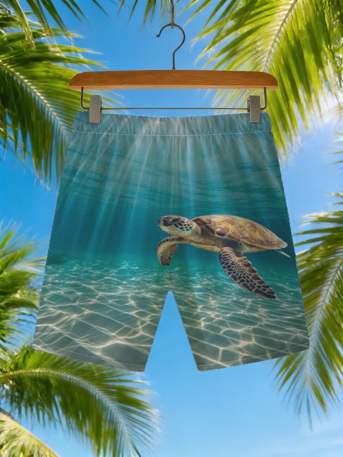 Sea turtle glides through sunlit waters, rays shimmering above. -  Beach shorts