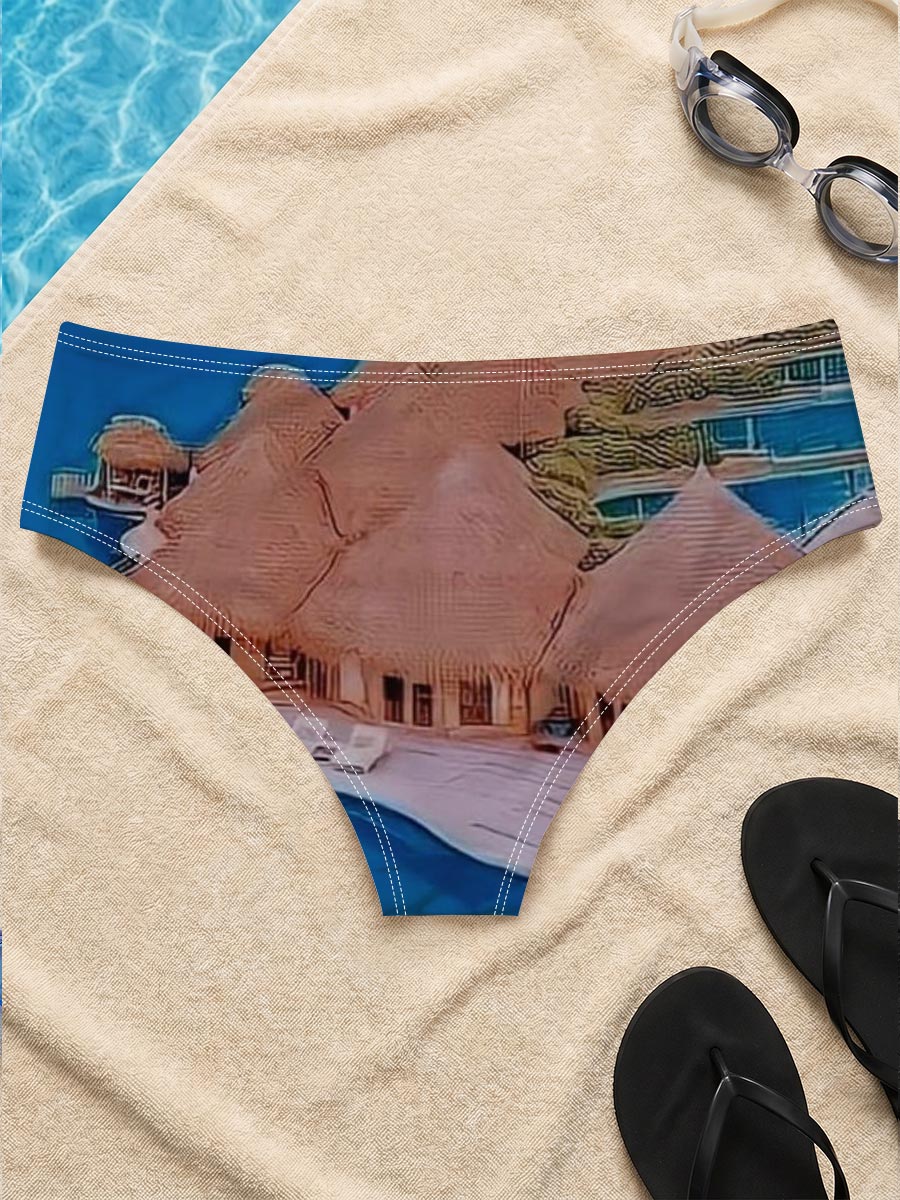 Overwater bungalows with private pools on a tropical island, surrounded by crystal blue waters and lush greenery. -  Men's swim trunks