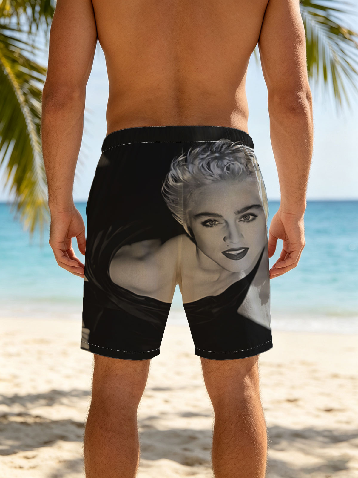 Madonna in a striking black and white portrait, showcasing bold makeup and voluminous blonde hair. -  Beach shorts
