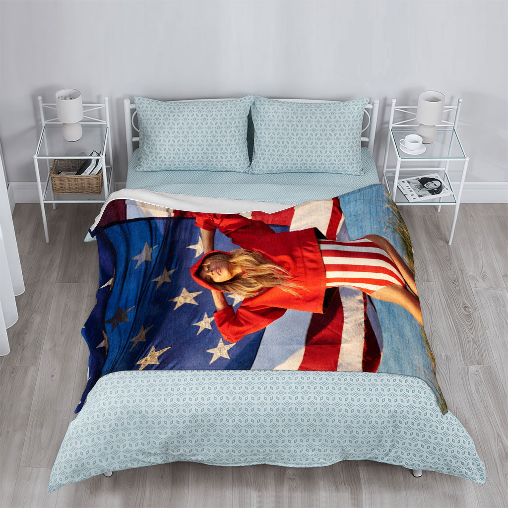 Beyonce in Red Hoodie and Striped Bodysuit Standing Before American Flag by the Beach - Blankets