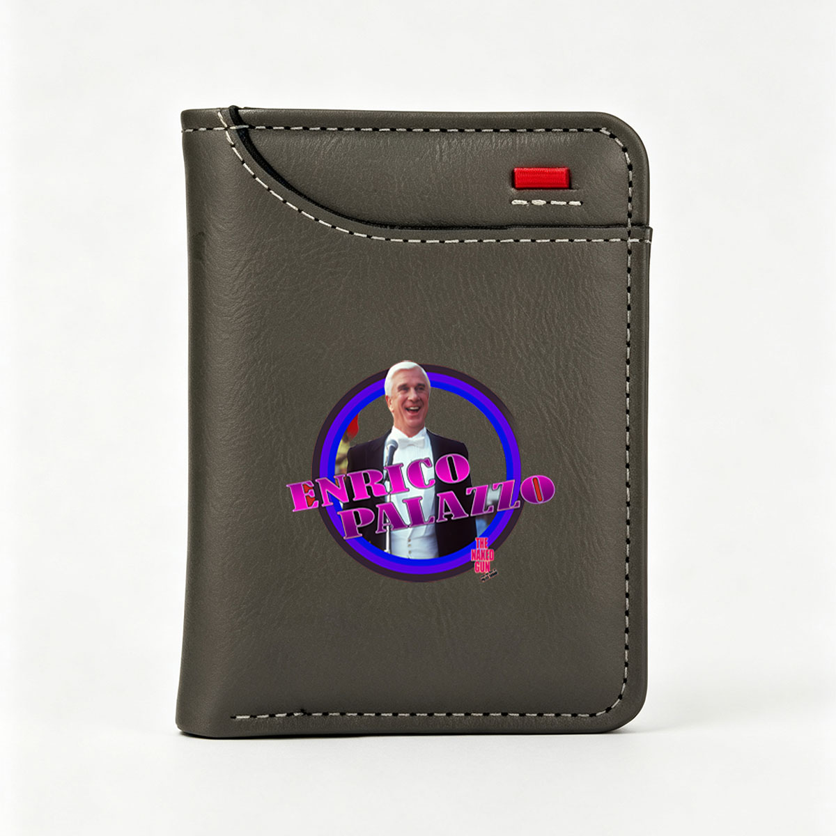 Enrico Palazzo from The Naked Gun, portrayed by Leslie Nielsen, in a comedic tuxedo scene. - Vertical Style Wallet
