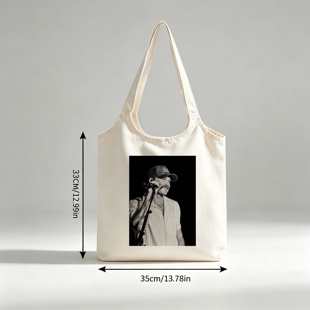 Ronnie Milsap Performing on Stage with Microphone in Black and White Photo - Canvas shoulder bags/