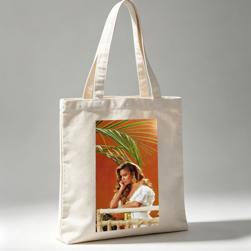 Maren Morris in a Tropical Scene Wearing a White Ruffled Dress with Palm Leaves in the Background - Canvas tote bags