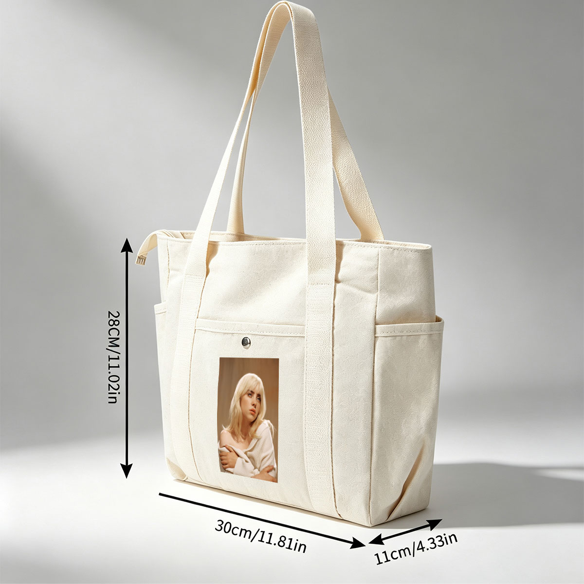 Billie Eilish in a Soft Portrait Wearing a White Off-Shoulder Sweater with Blonde Hair and Blue Eyes - Multi-pocket bags