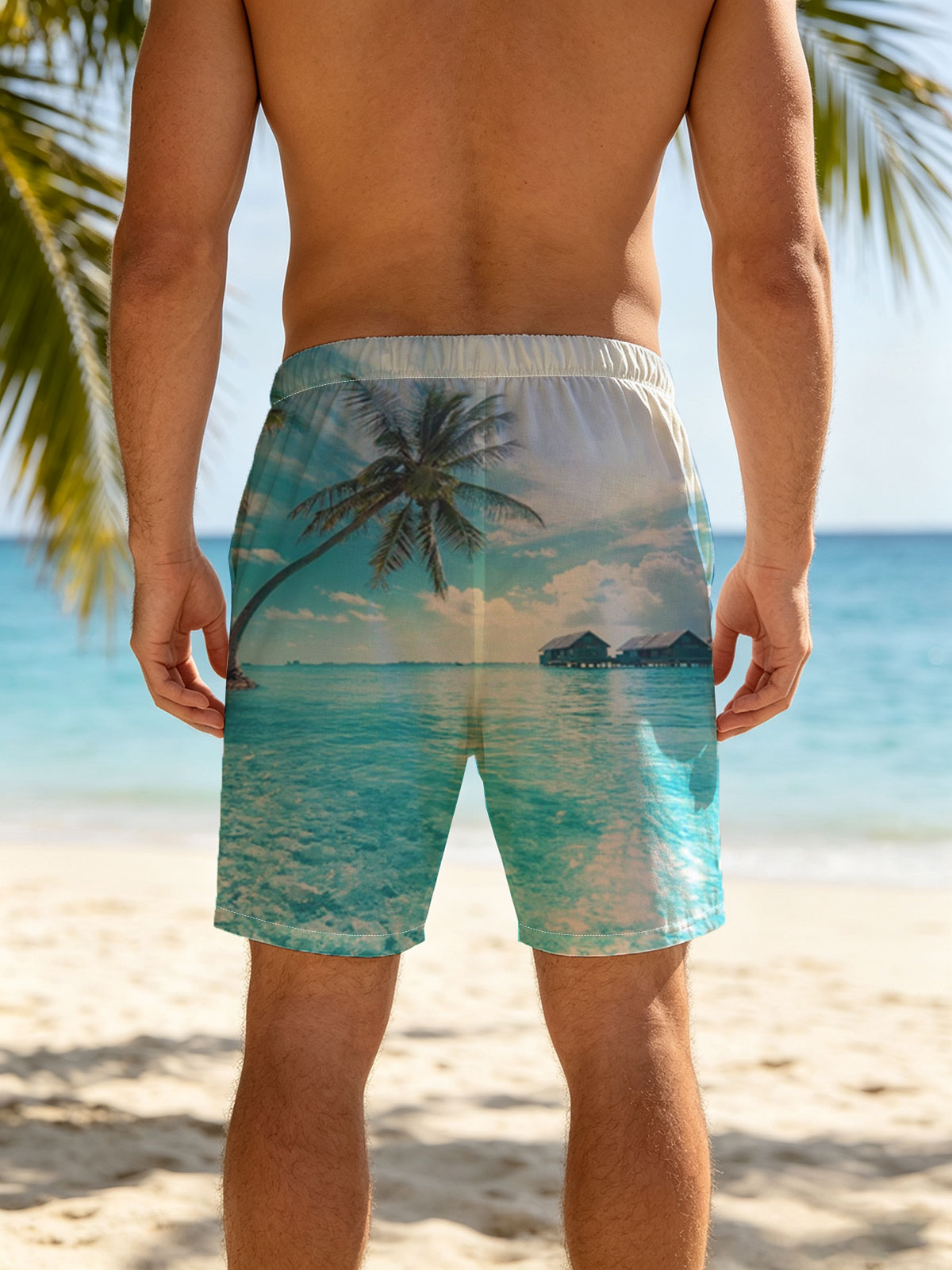 Tropical paradise with palm trees and overwater bungalows in crystal clear blue waters. -  Beach shorts