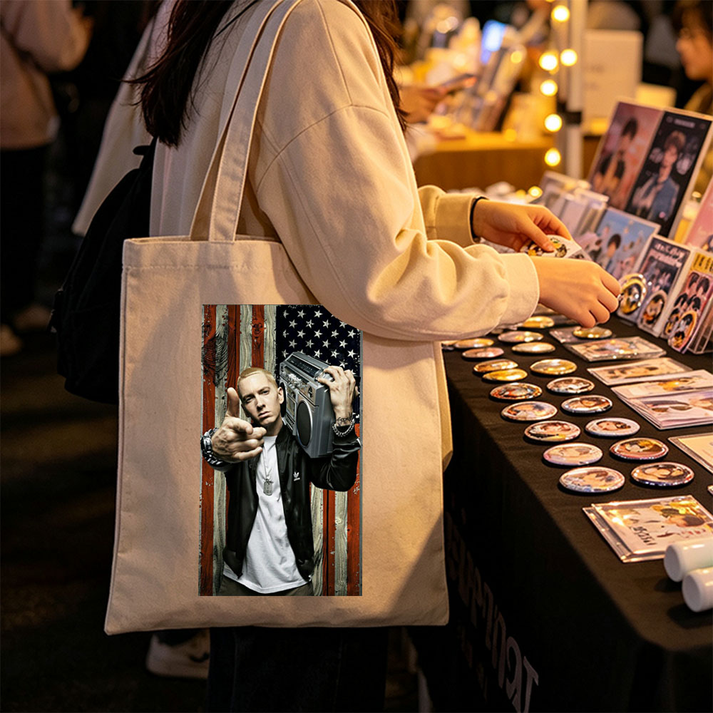 Eminem Holding Boombox Pointing at Camera Against American Flag Background - Canvas tote bags