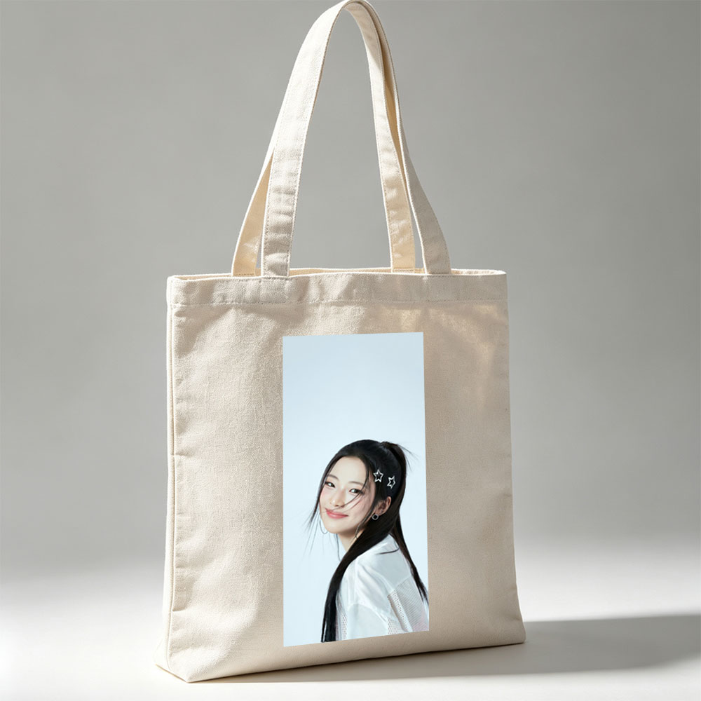 Korean Actress in White Outfit with Star Hair Clips Smiling Softly Against Light Blue Background - Canvas tote bags
