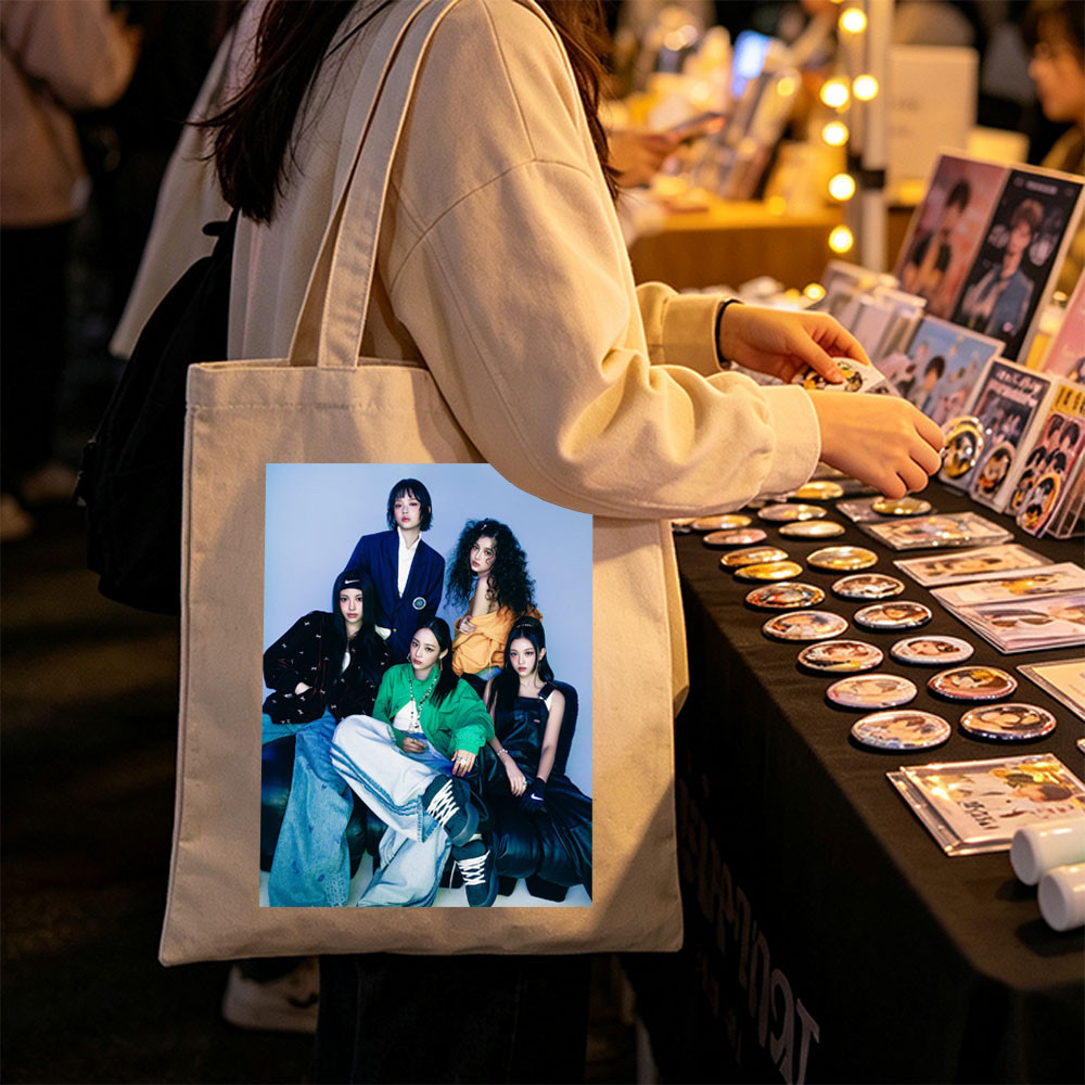 NewJeans Group Photo - Five Members in Stylish Outfits Posed Against a Blue Background - Canvas tote bags