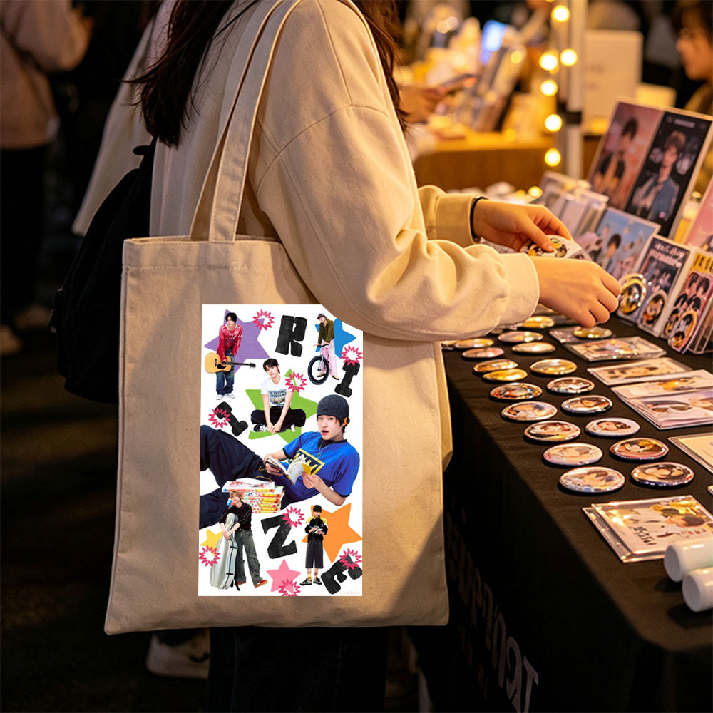 RIIZE Members in Casual Moments Reading, Playing Guitar, and Riding Bike with Vibrant Star Background - Canvas tote bags