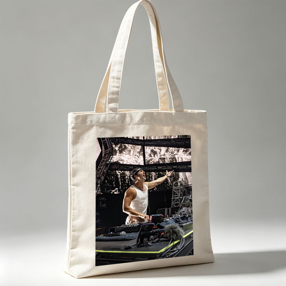 Martin Garrix Live Performance on Stage with DJ Equipment and Energetic Gesture - Canvas tote bags