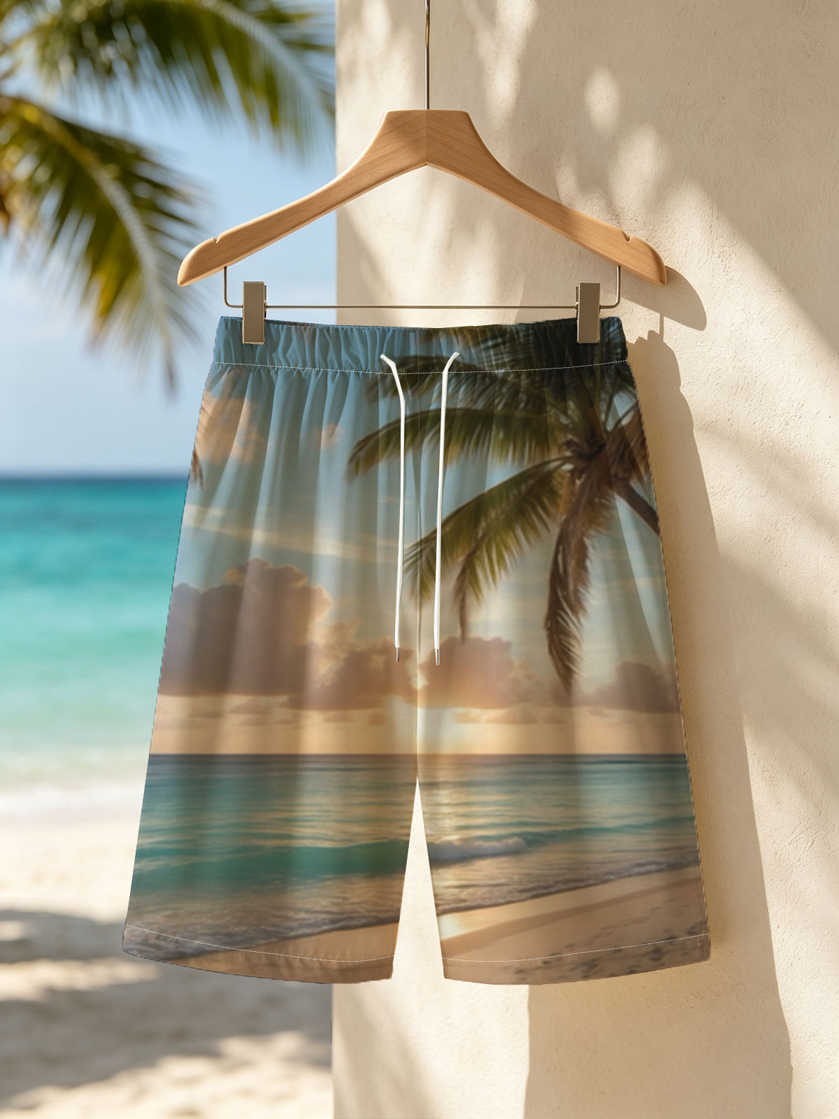 Sunset on a tropical beach with palm trees and calm ocean waves. -  Beach shorts