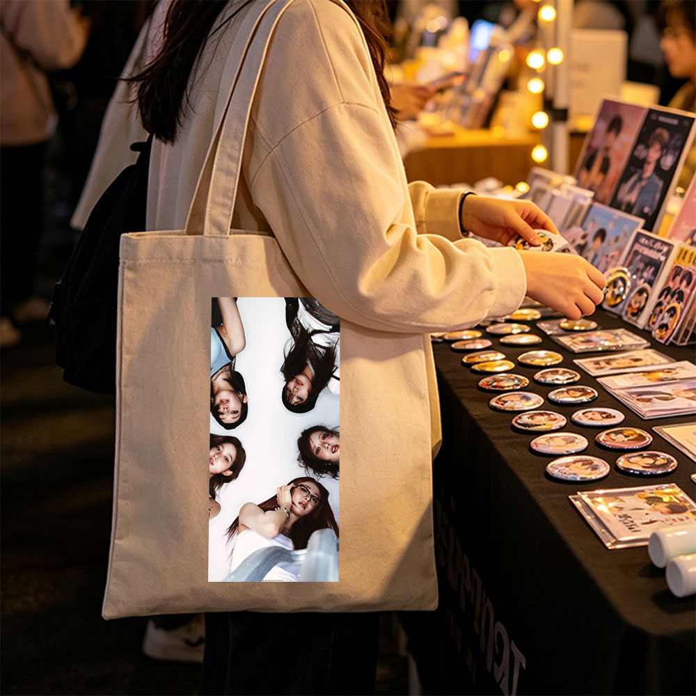 NewJeans Members Lying in a Circle on White Background with Expressive Poses and Fashionable Outfits - Canvas tote bags