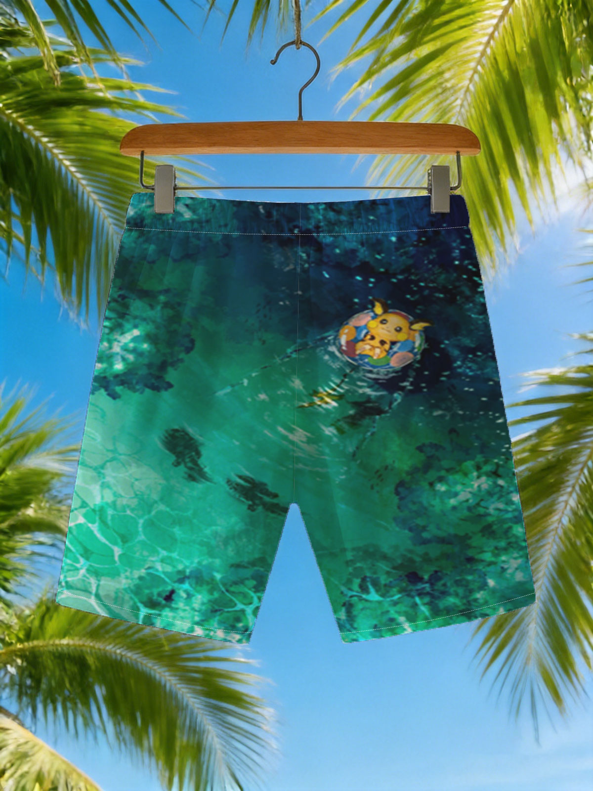 Pikachu floating on a colorful ring in a serene, turquoise pool with fish swimming below. -  Beach shorts