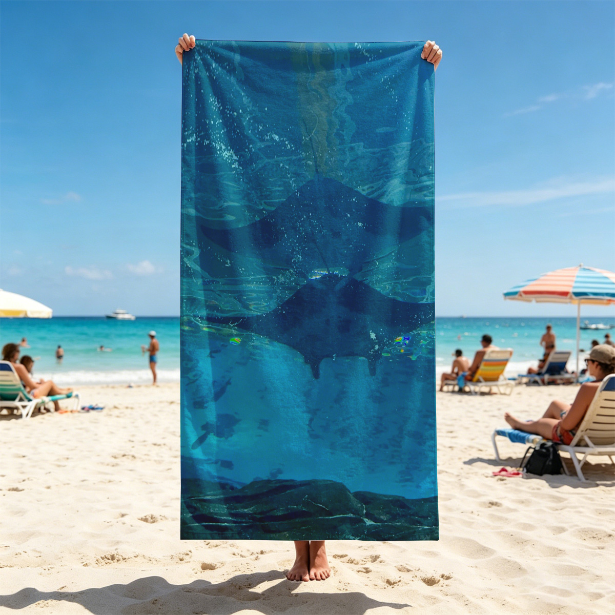 Graceful manta rays glide through clear blue waters, their silhouettes dancing beneath the surface. - Beach towels