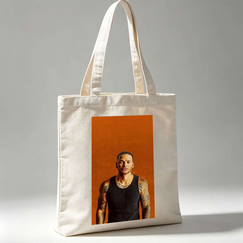 Liam Payne Standing in Black Tank Top with Visible Tattoos Against Orange Background - Canvas tote bags