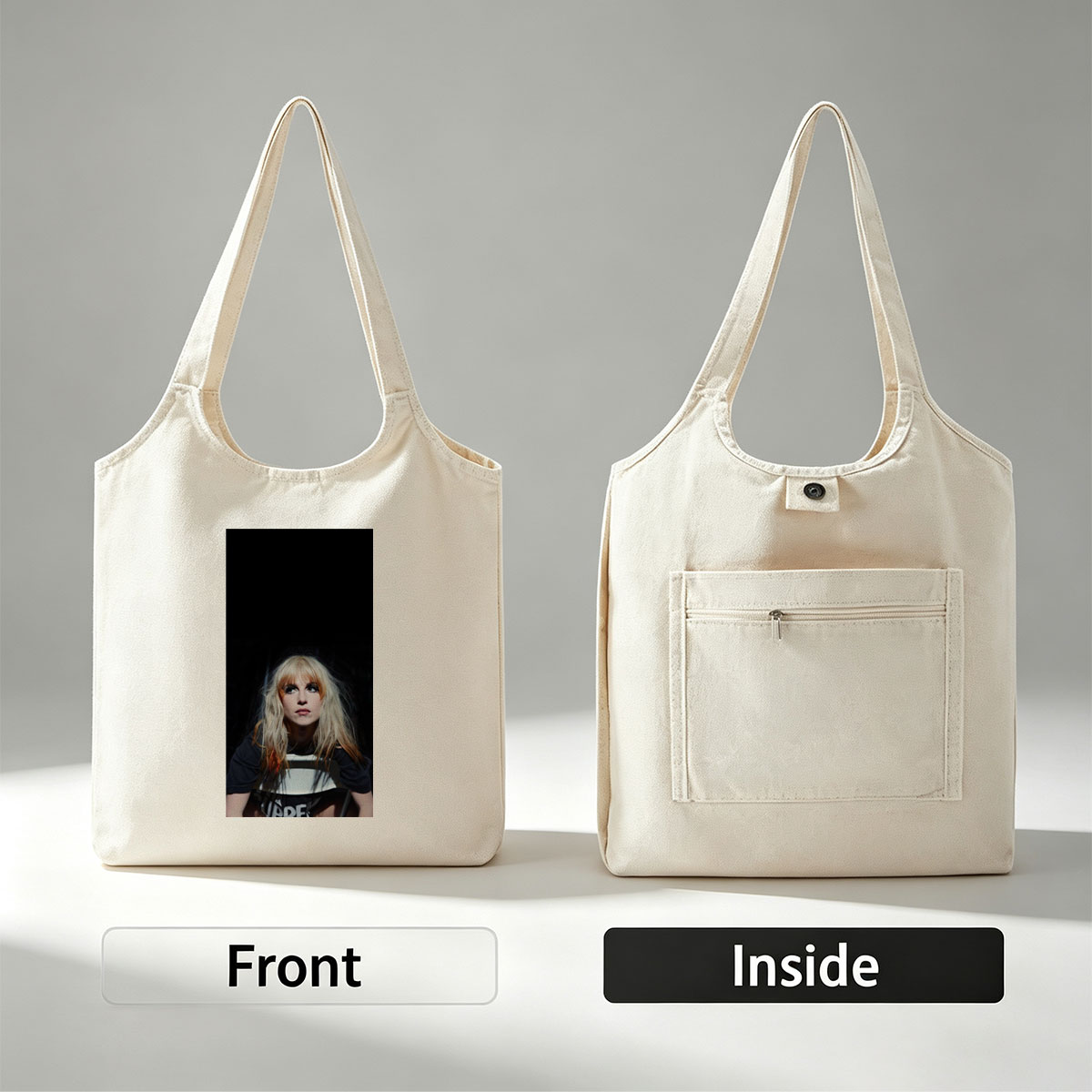 Hayley Williams in a Dramatic Portrait with Intense Gaze and Blonde Hair Against Dark Background - Canvas shoulder bags/