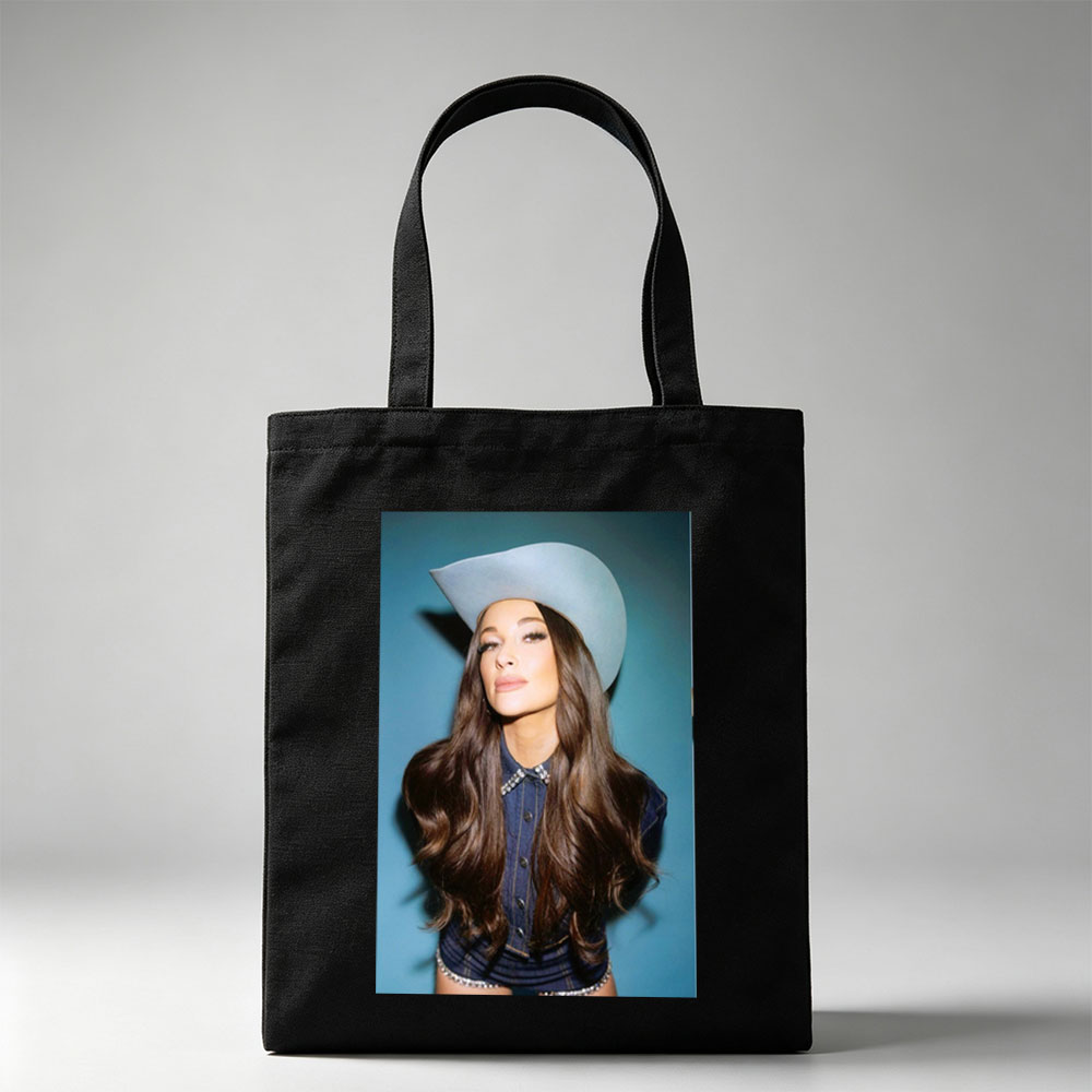 Kacey Musgraves in a Cowboy Hat and Denim Outfit Against a Blue Background - Canvas tote bags
