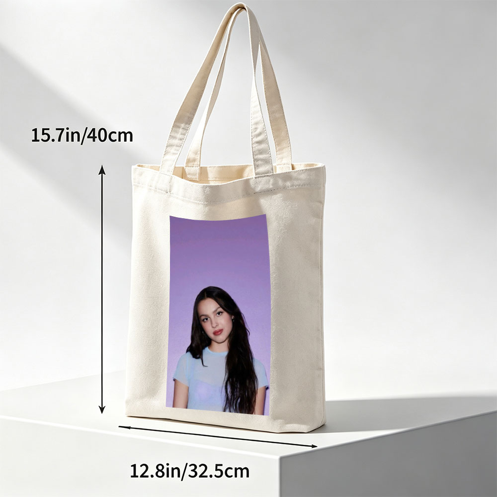 Olivia Rodrigo in a Soft Blue Top Against a Purple Gradient Background - Canvas tote bags
