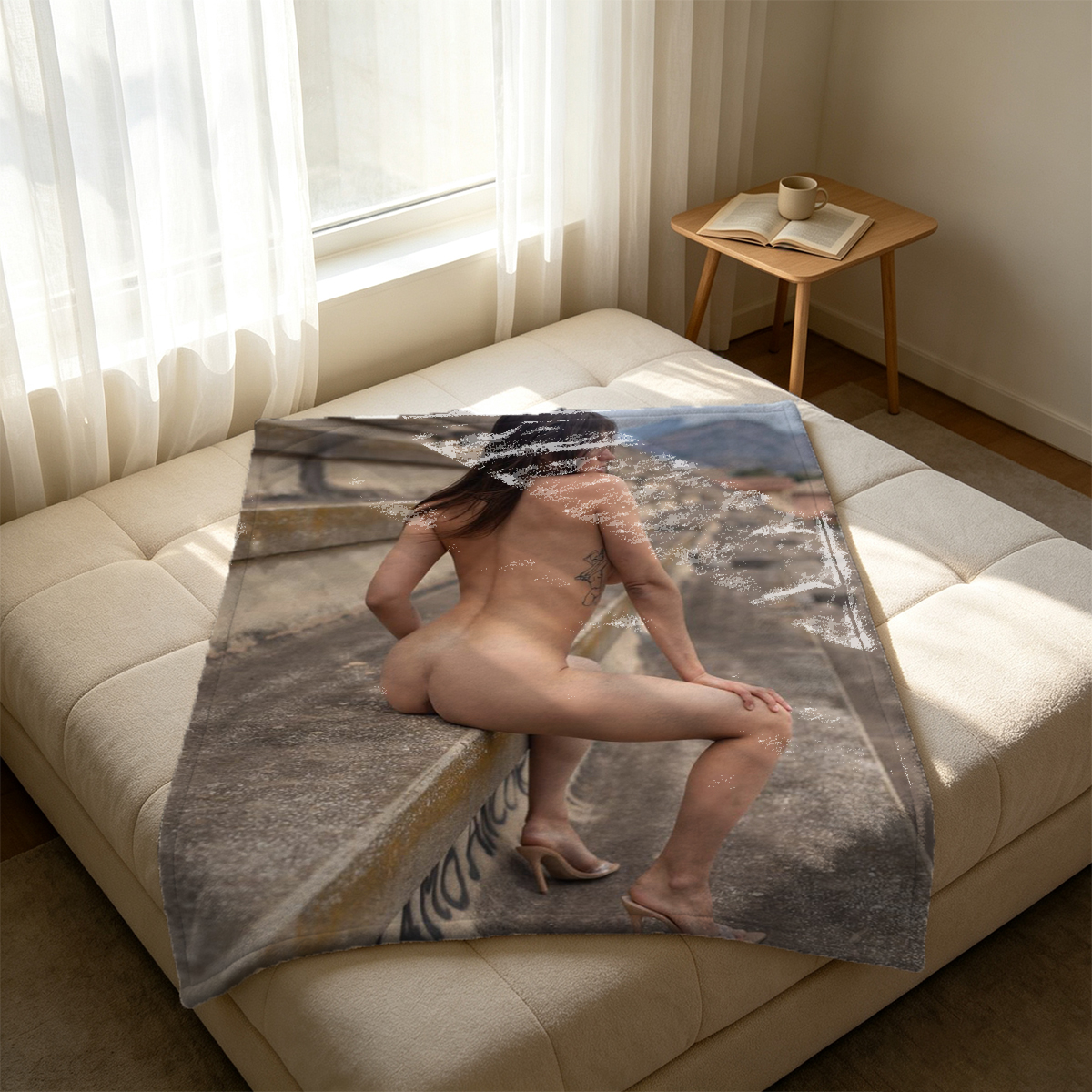Blonde in black lingerie bending over leather couch. - Blanket