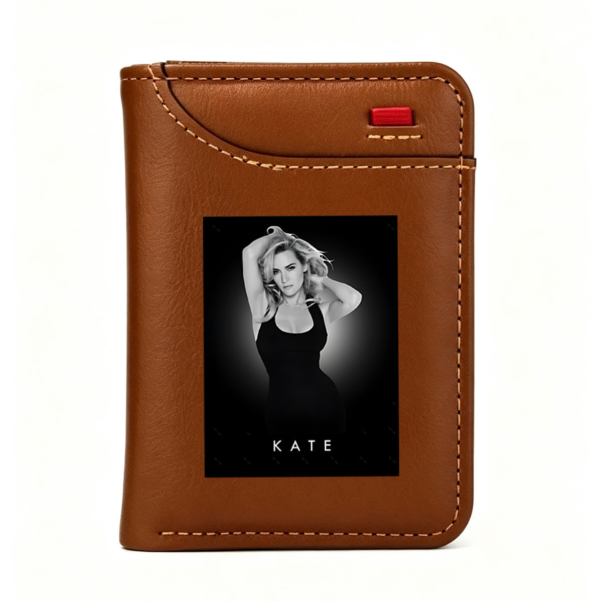 Kate Winslet in a striking black dress, posing with hands in her hair against a dark background. - Vertical Style Wallet
