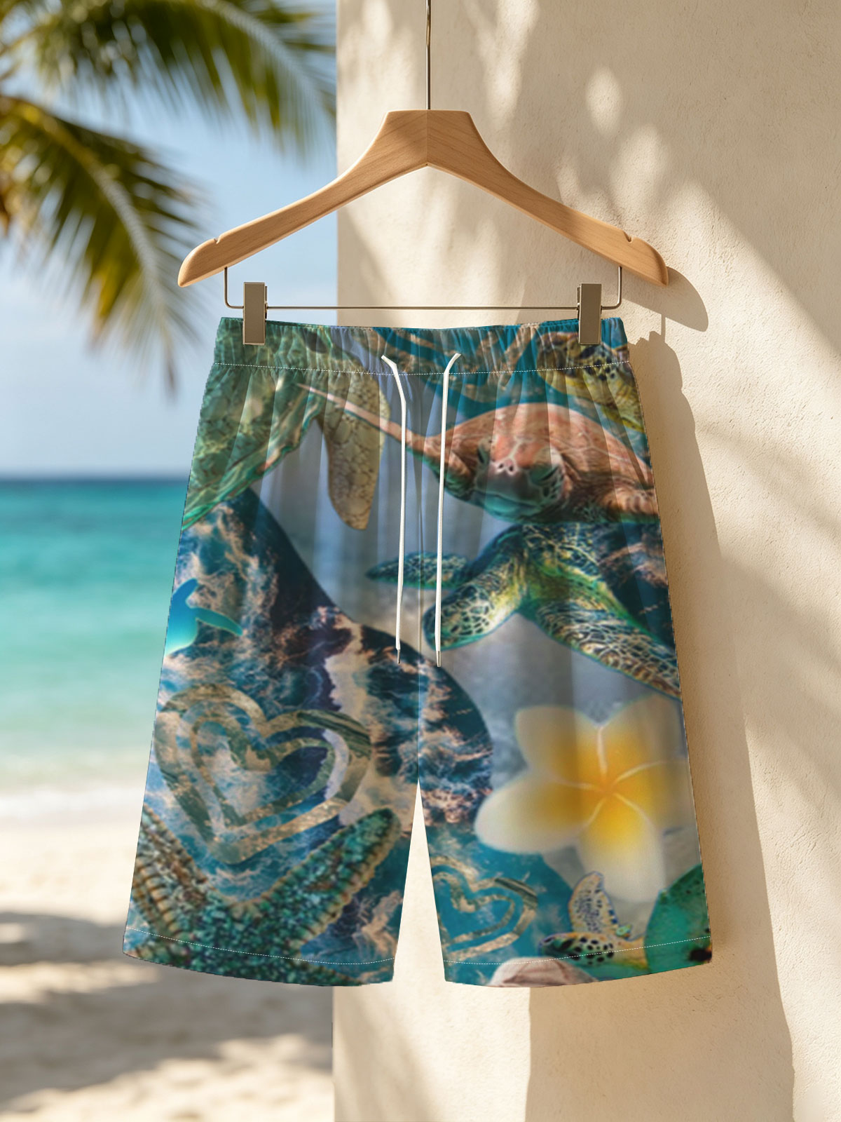 Turtles, stars, and flowers in a heart-filled ocean scene -  Beach shorts