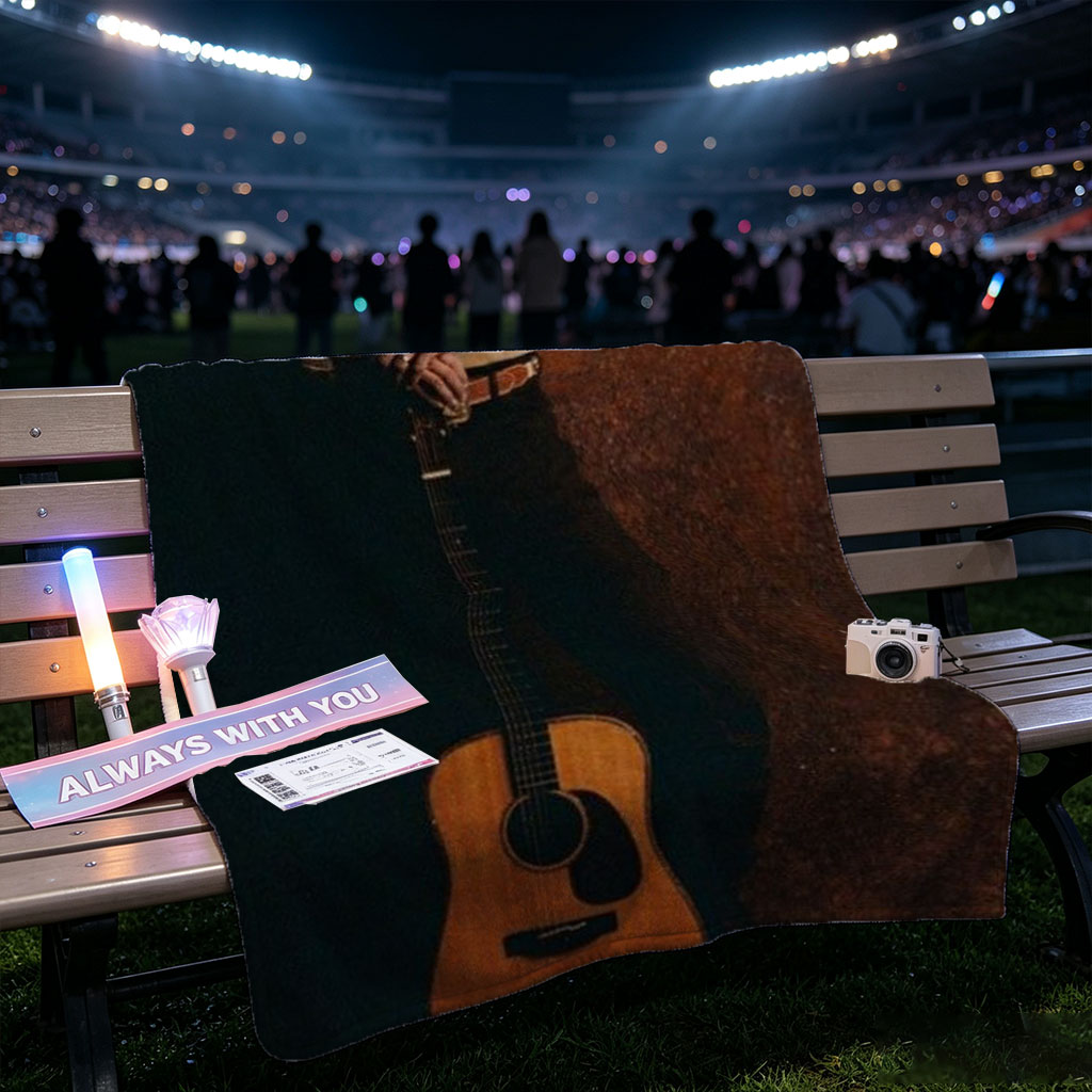George Strait Holding Acoustic Guitar in Cowboy Attire Against Rustic Background - Blankets