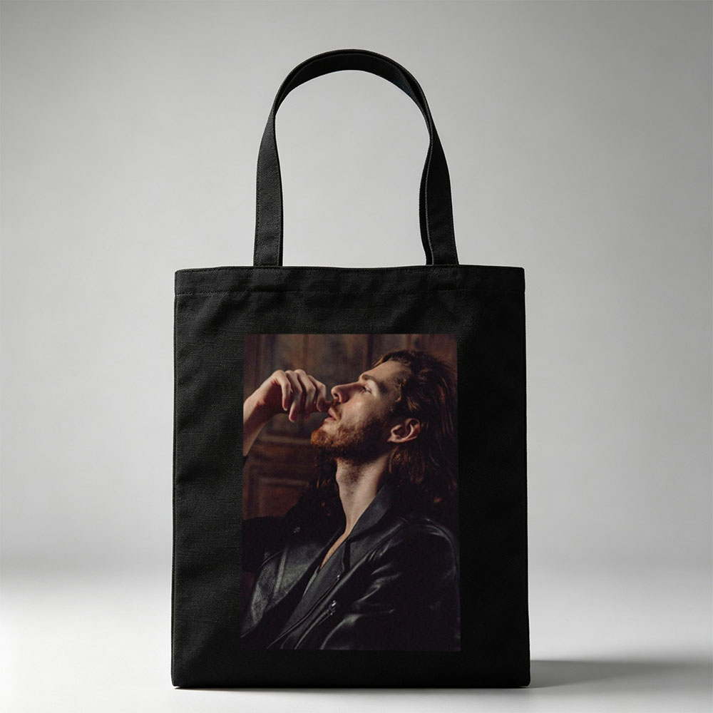 Hozier in a Moody Portrait Wearing a Leather Jacket and Gazing Upward - Canvas tote bags